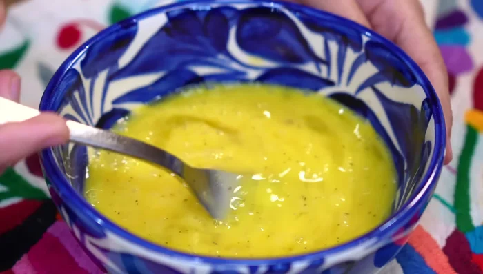 Add the beaten eggs to the cactus and cheese mixture. Mix well.