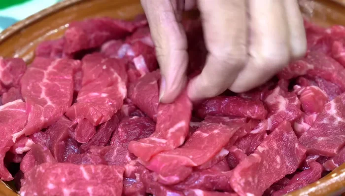 Cut beef into strips, season with salt and pepper, and let rest for at least 30 minutes (preferably longer).