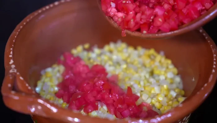 Add the chopped tomatoes and salt to the pot and cook until they release their juices (about 5 minutes).