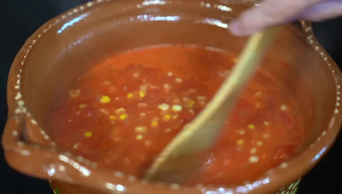 Add the poblano pepper strips and stir well. Lower the heat to medium-low and cook for 10-12 minutes.