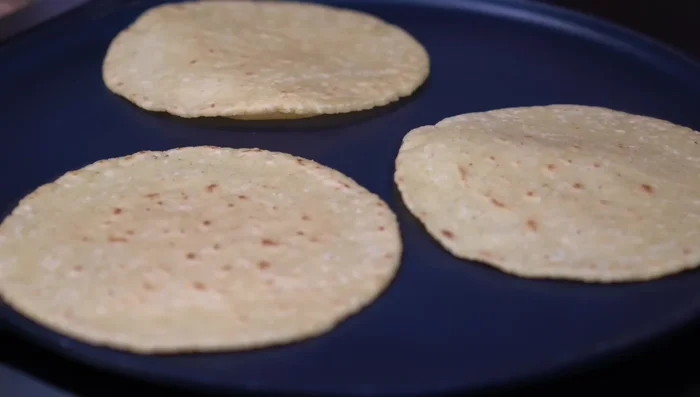 Serve hot with warm, freshly made tortillas, white rice, cilantro, and lemon.