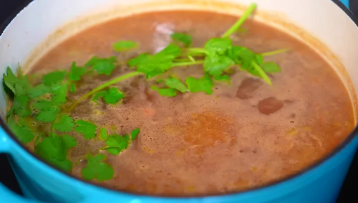 Stir in cilantro, reduce heat, cover, and cook for another 15 minutes, stirring occasionally.