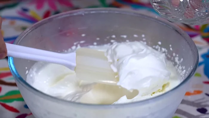 Reserve a few tablespoons of whipped cream for garnish.