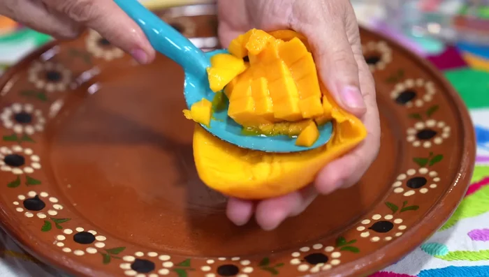 Add the mango pulp to a blender and blend until smooth.