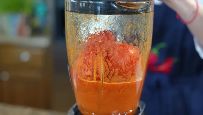 Add the blended tomatoes and blend again until smooth.