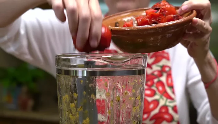 Add the roasted tomatoes to the blender and pulse a few times for a textured sauce.