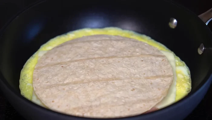 Press lightly and cook until tortilla is heated through and cheese is melted. Flip and cook the other side.