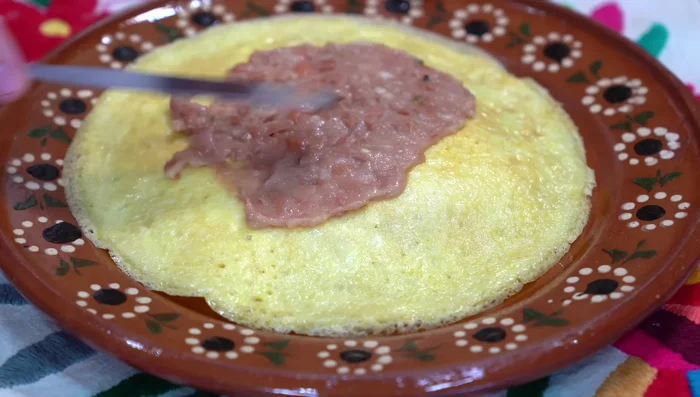Add warm beans and guacamole (optional) before serving.