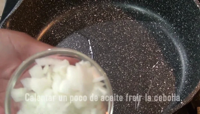 Sauté chopped onion in oil until translucent.