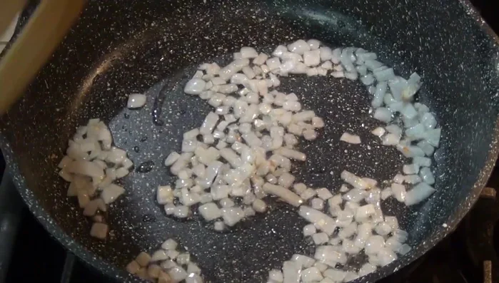 Add the blended tomato sauce to the sautéed onion.