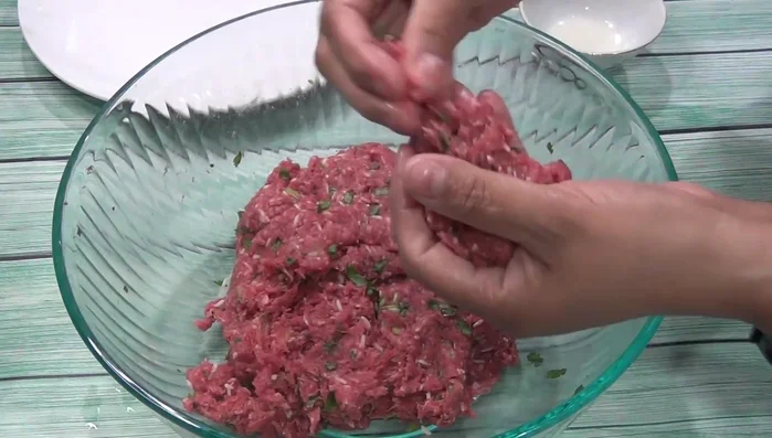 Brown the meatballs in a pan with a little oil.
