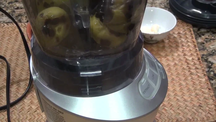 Blend the roasted chiles, garlic, and cumin.
