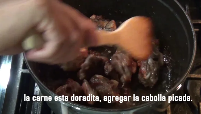 In a pot, combine the cooked pork ribs, blended chili sauce, chopped onion, and 2 cups of water. Simmer until the sauce thickens.