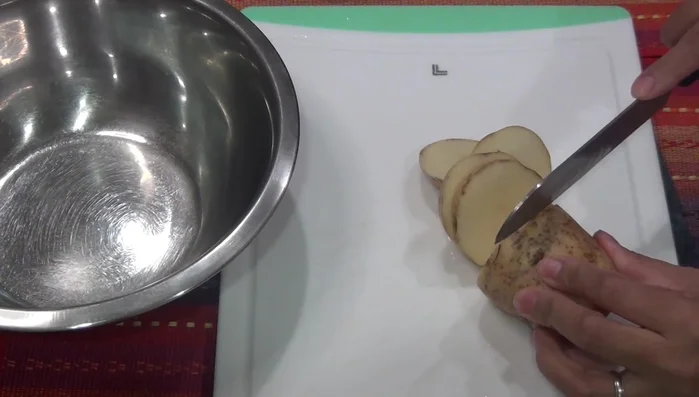 Prepare the potatoes: Cut potatoes into slices or squares. Season with salt, pepper, garlic powder, and a splash of olive oil. Add some of the reserved green sauce.