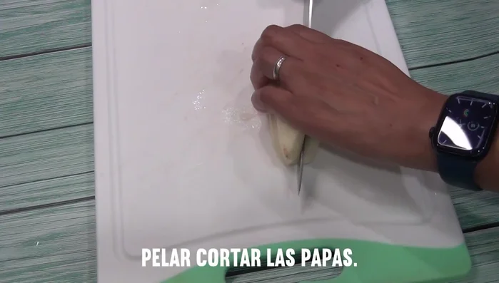Peel and dice potatoes into small squares. Submerge in water to prevent browning.