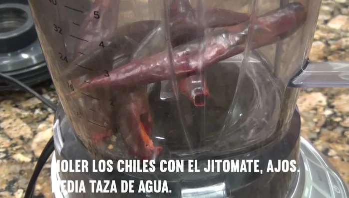 Blend roasted chilacas, tomatoes, garlic, and 1/2 cup water until smooth.
