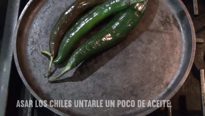 Wash chilacas and place them on a griddle with a little oil to cook evenly. Roast until slightly charred.