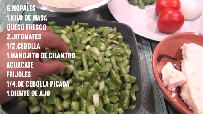 Prepare the nopales: Cut 6 nopales. Combine them with 2 peeled tomatoes, ½ chopped onion, cilantro sprigs, and salt. Cook until the water is consumed. Remove peels.