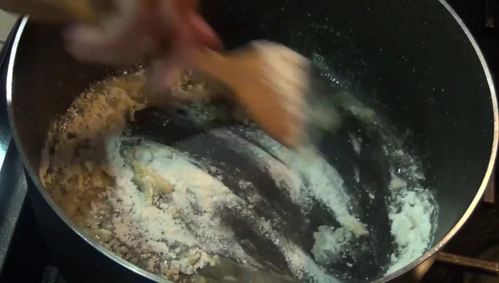 Add flour to the melted butter and garlic. Gradually add the chicken broth, stirring constantly.