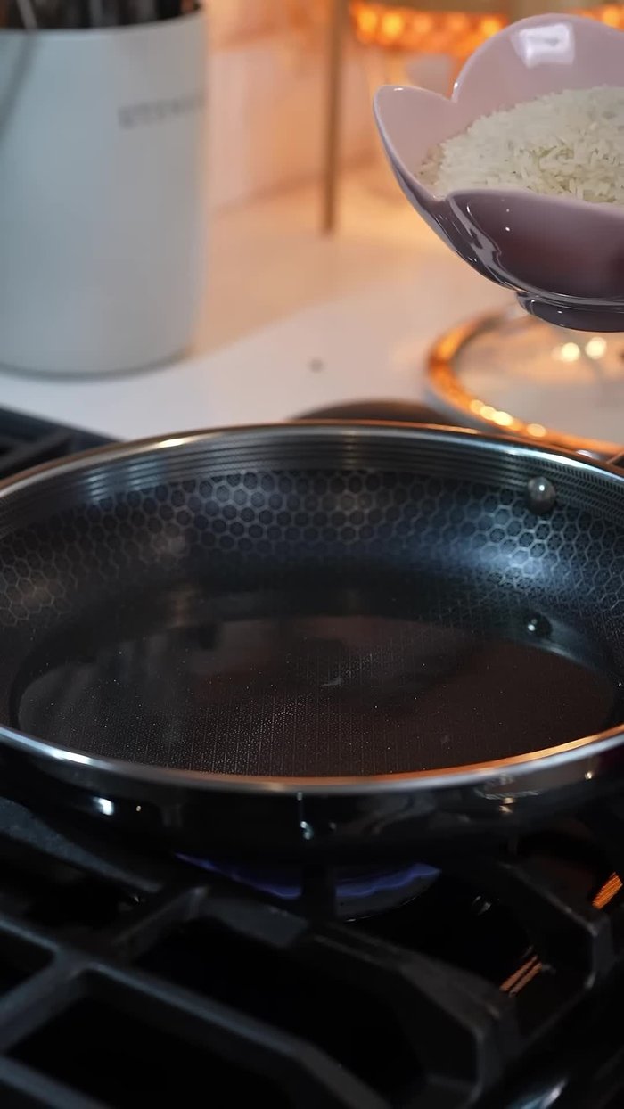 Add 1 1/2 cups of dry long grain white rice and fry for 3 minutes.