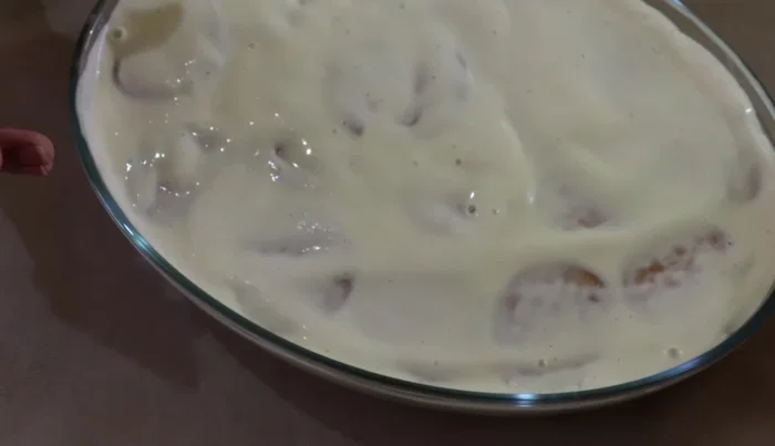 Refrigerate the partially assembled dessert to allow it to firm up while preparing the peach jelly.