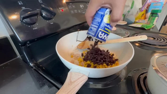Combine the cooked chicken, corn, and black beans. (Start at 420.199)
