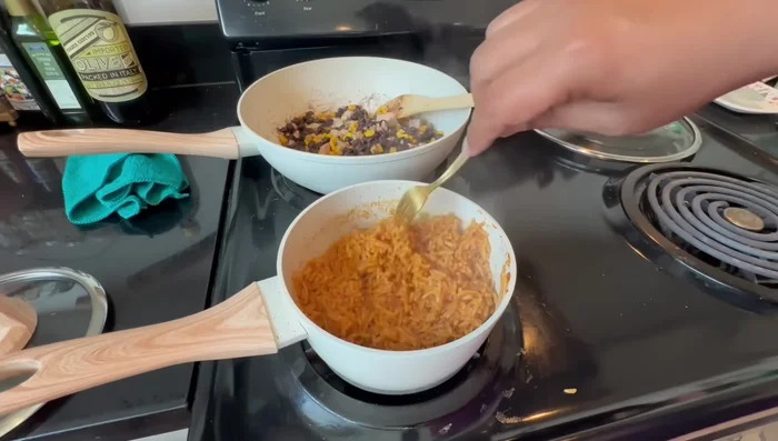 Once the rice is cooked, fluff it with a fork and let it sit for another two minutes. (Start at 473.36)