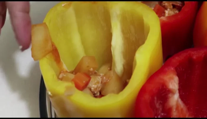 Stuff the bell peppers with the meat mixture, adding cheese squares between layers.