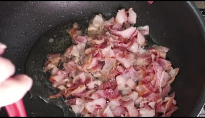 Remove the bacon, leaving the bacon fat in the pan.