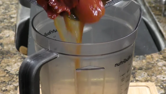 Blend chilies, tomatoes, and oregano into a sauce.
