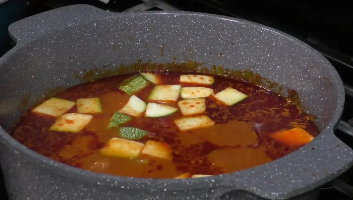 Add zucchini and 2 tablespoons of cilantro. Season with salt.