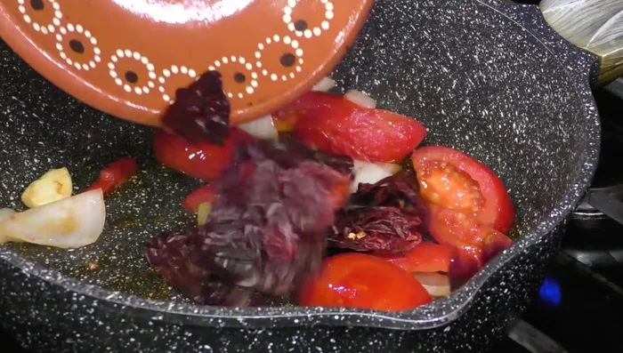 Add guajillo and puya chilies; cook for 6 minutes.