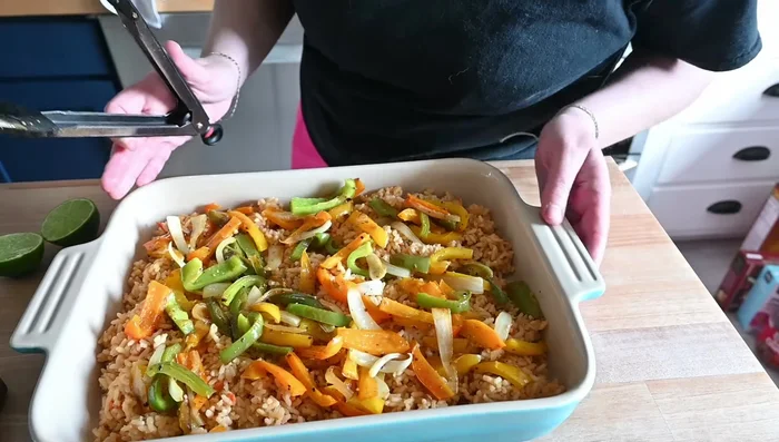Arrange the baked chicken thighs on top of the vegetables.