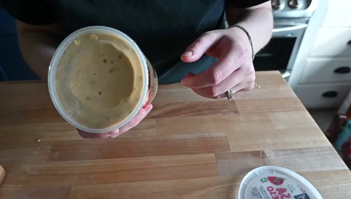 Spread half of the queso over the chicken.