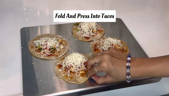Fold the rotis to create tacos.