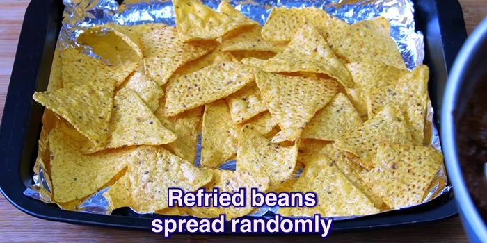Season the ground beef with taco seasoning.