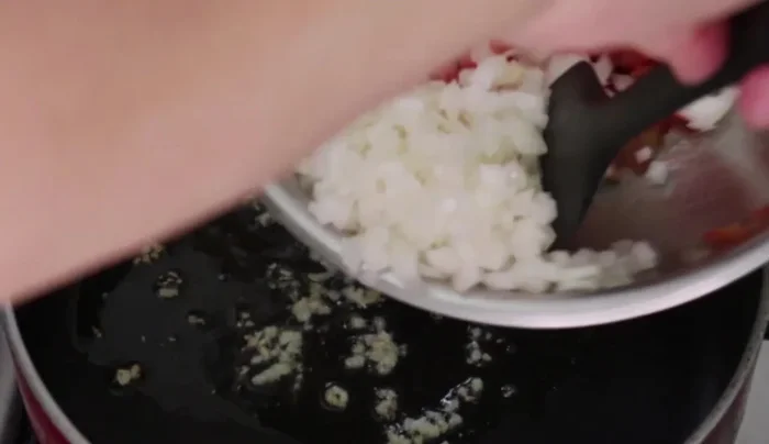 Add chopped onion and sauté for 5 minutes until translucent. (57.96)