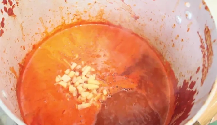 Combine ingredients: Strain the blended chili mixture and add it to the pot. Add the carrots and potatoes and enough water to cover. Bring to a boil. Add the octopus (because it takes longer to cook).