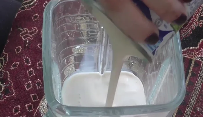 Blend the milks and coffee: In a blender, combine regular milk, evaporated milk, condensed milk, half-and-half cream, and instant coffee (85.86).