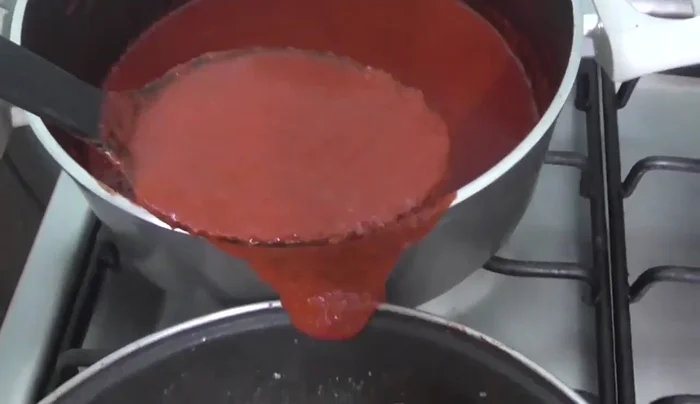 Add the chili sauce to the shrimp and simmer together for about 5-10 minutes to allow the flavors to blend.
