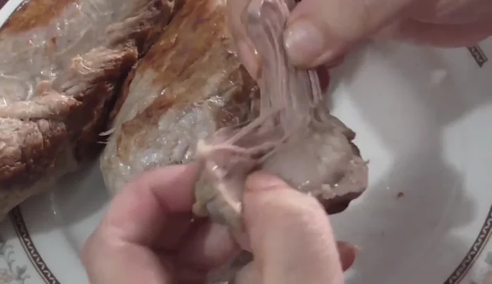 Shred the cooled pork.