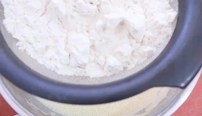 In a strainer, combine wheat flour and baking powder. Gradually add to the wet ingredients, mixing on low speed until just combined. Do not overmix.