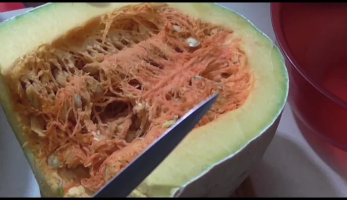 Cut the pumpkin in half, remove seeds and pulp.