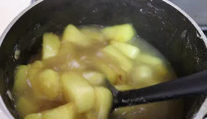 Strain the cooked pineapple filling to remove any lumps and let it cool completely.