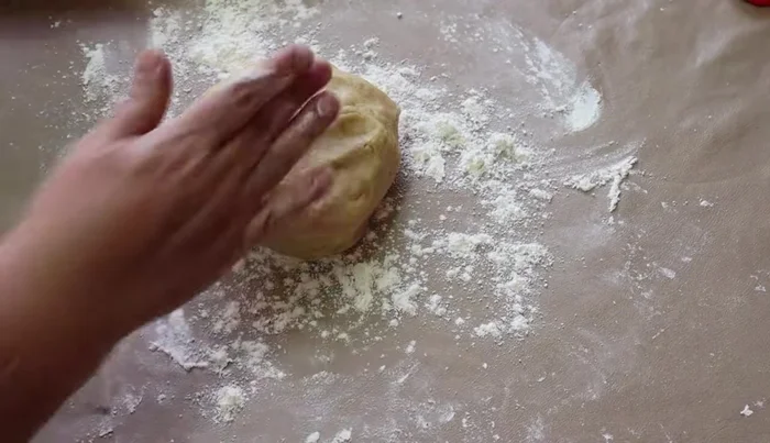 Roll out the other half of the dough and place it over the filling. Seal the edges.