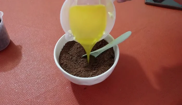 Combine crushed cookies with melted butter and mix well.
