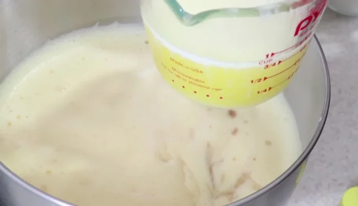 Add melted butter (or vegetable oil) to the egg mixture and beat for another 3 minutes.
