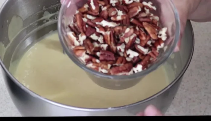Fold in the chopped walnuts.