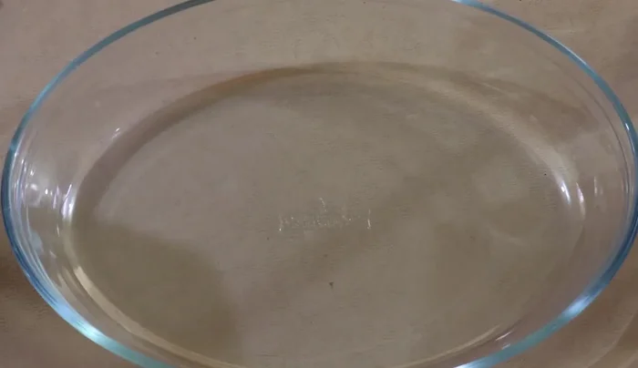 In your mold, layer a small amount of the milk mixture, then a layer of crushed Maria cookies. Repeat layers until almost full, leaving about 1cm of space at the top.