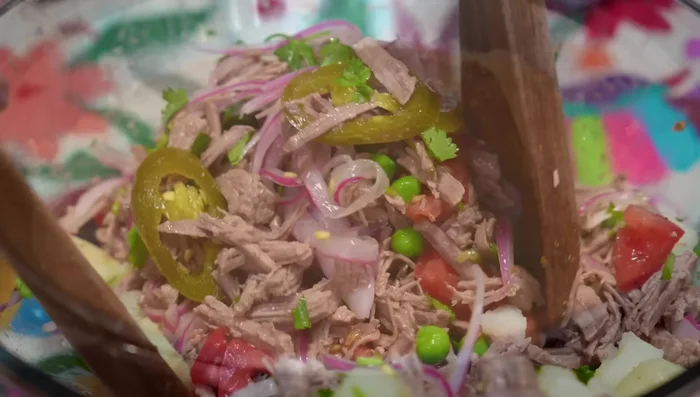 Serve the shredded beef on tostadas spread with refried beans, topped with crumbled fresh cheese and avocado slices.